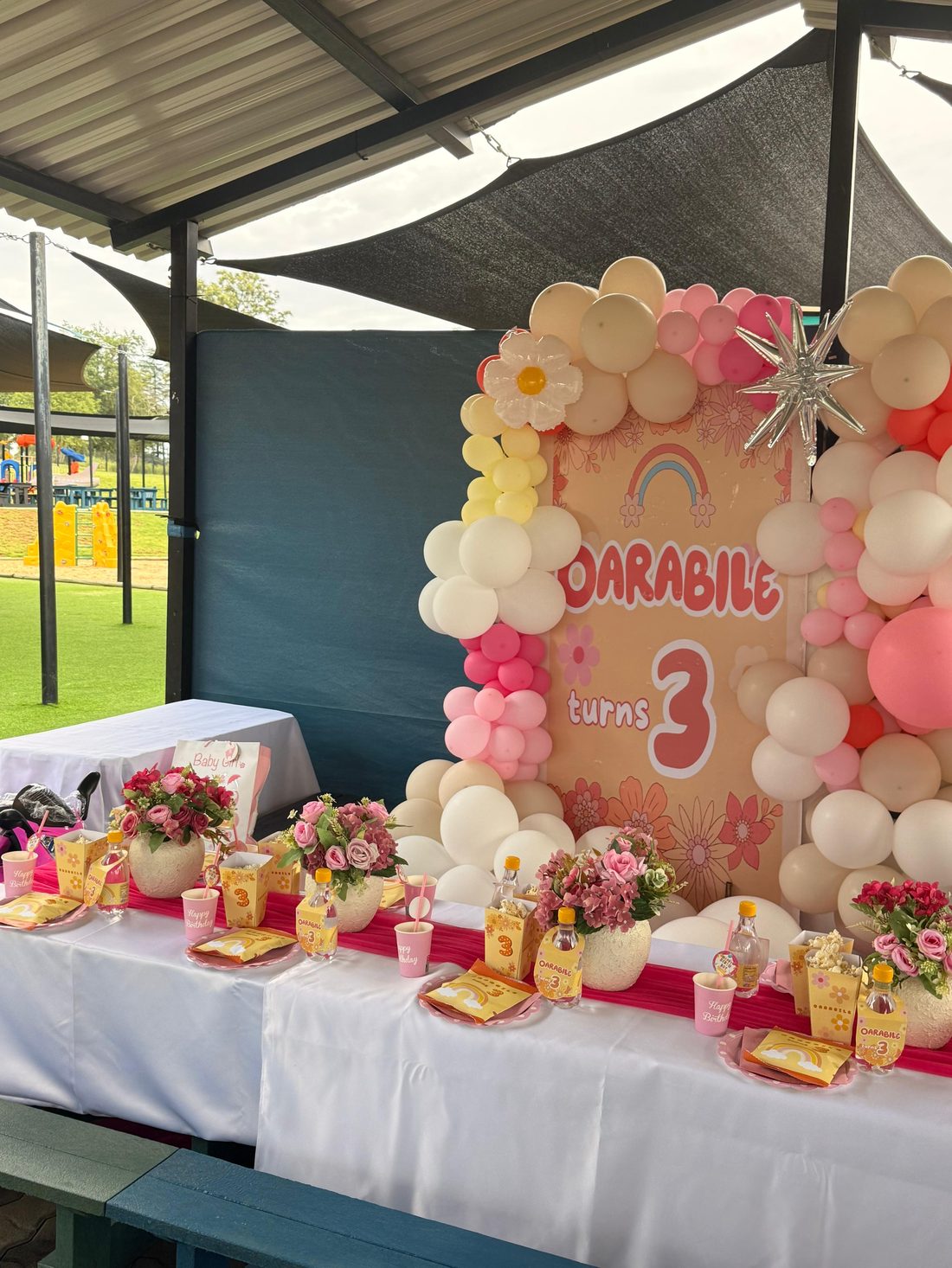 Oarabile party setup with balloon arch